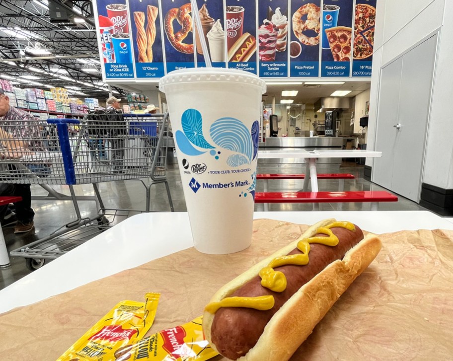 sam's club food court hot dog and soda sitting on table