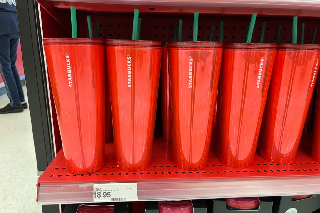 red starbucks cups on shelf