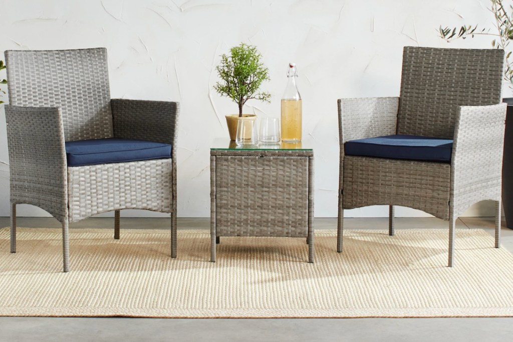 wicker chairs with table on rug