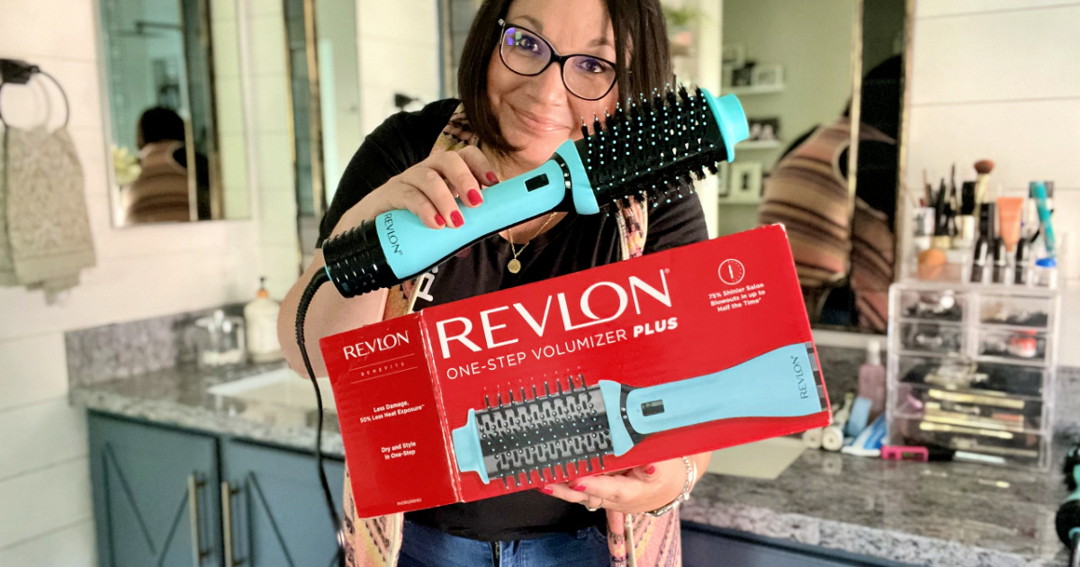 woman holding Revlon 2.0 Volumizer Plus