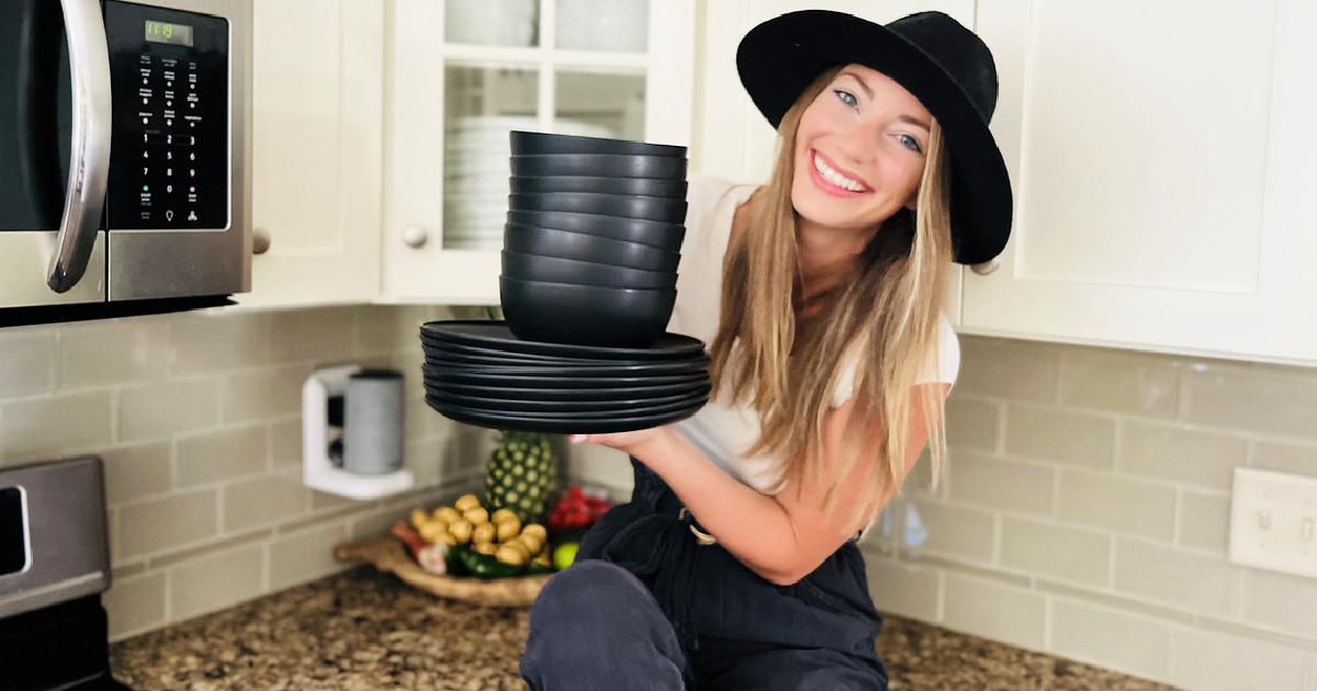 woman holding room essentials tableware from target