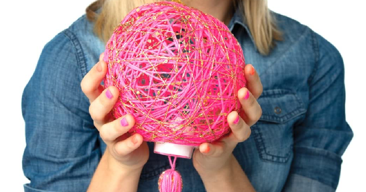 girl holding yarn craft 