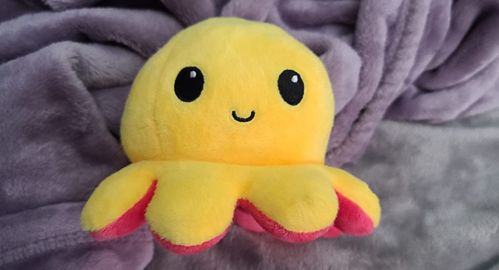 yellow and red plush reversible