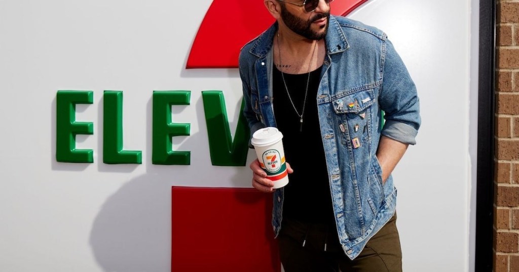 man holding coffee outside 7 Eleven