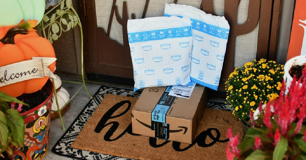 amazon prime packages in front of a door in the fall