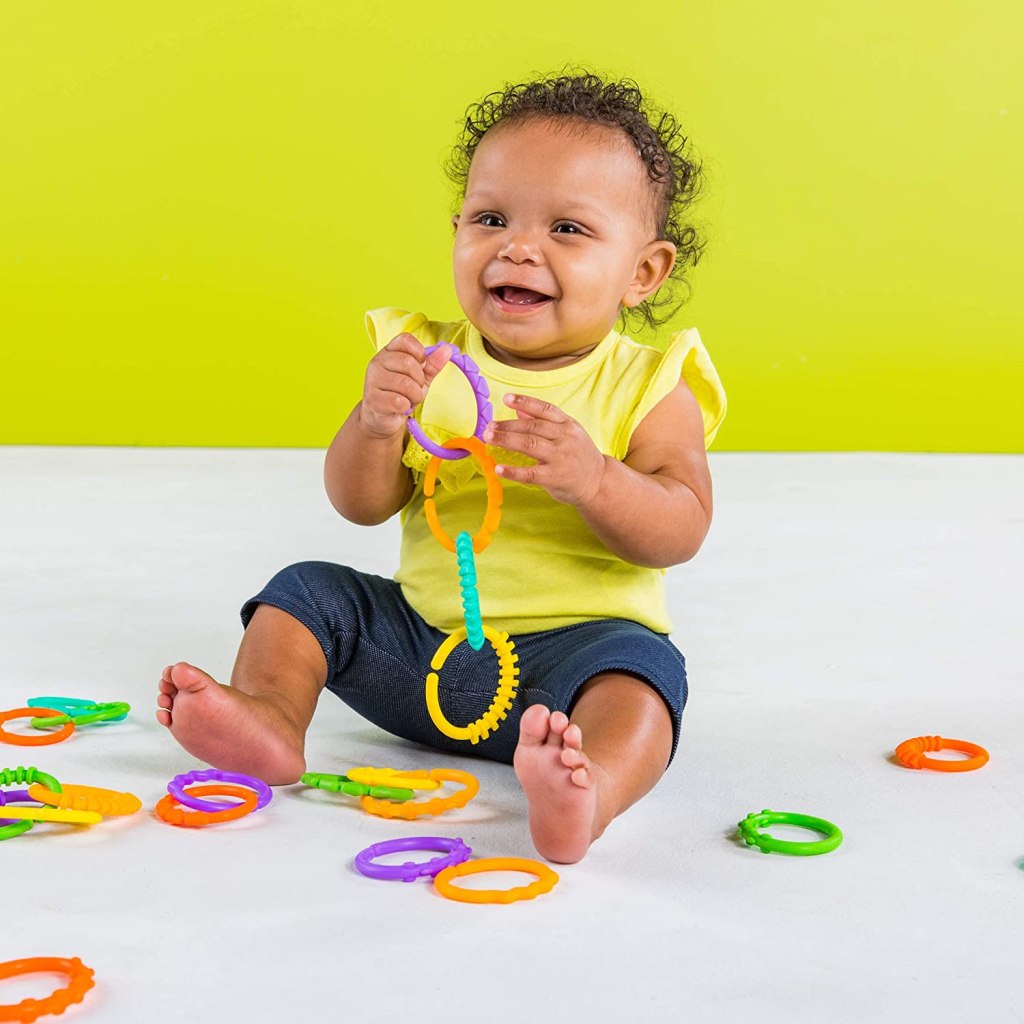 baby playing with Bright Starts Lots of Links Rings
