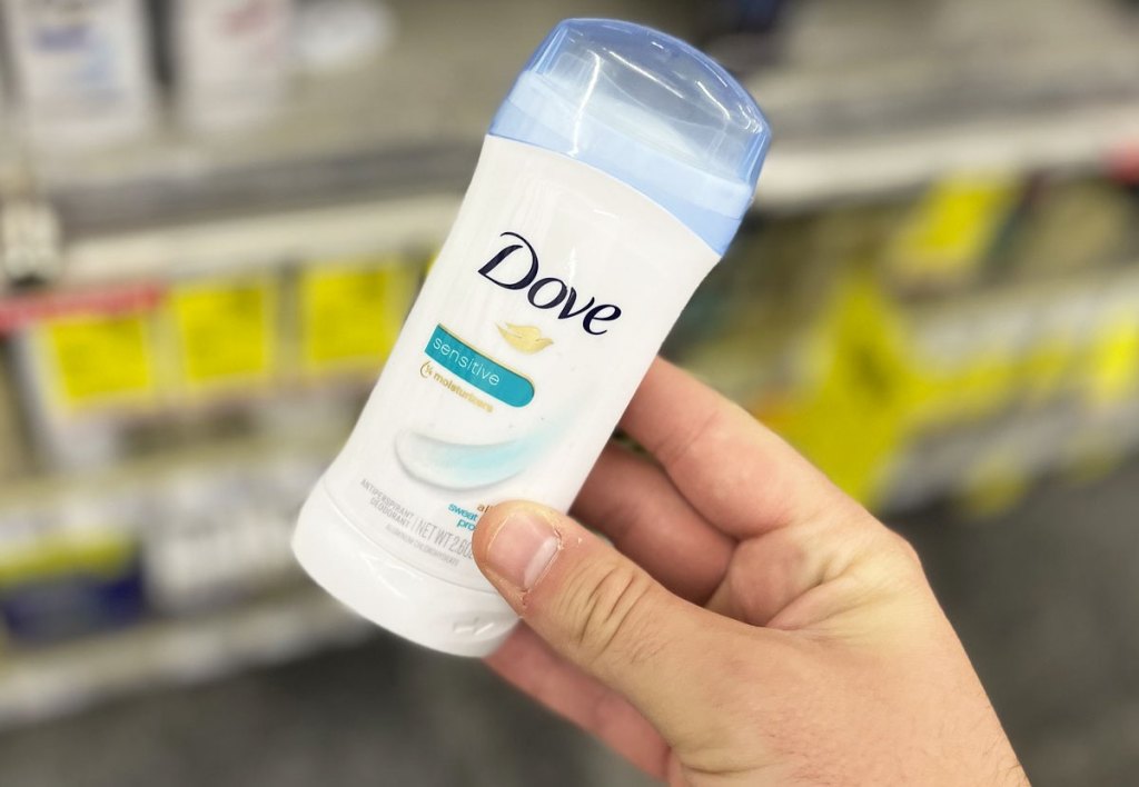 hand holding dove deodorant