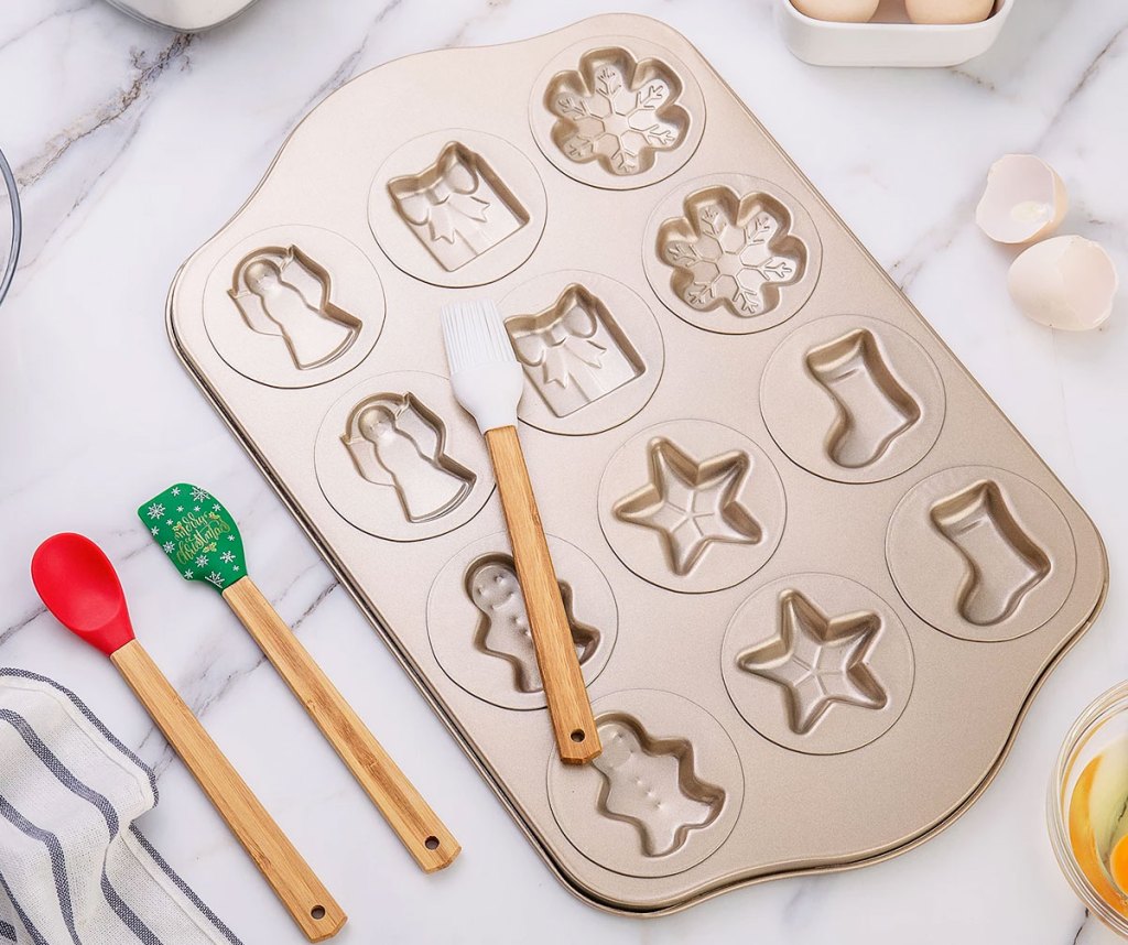 christmas cookie baking sheet with spatulas on kitchen counter