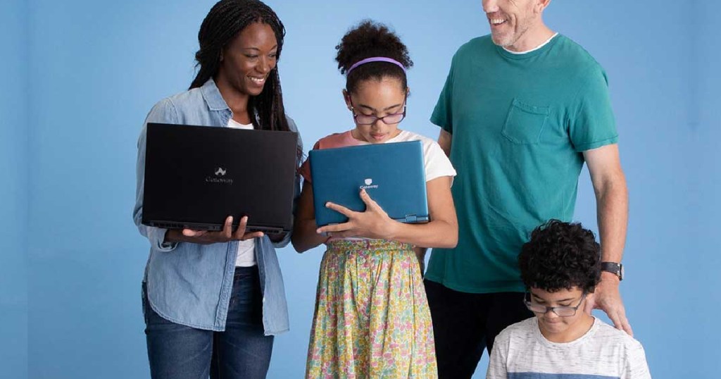 family holding laptops