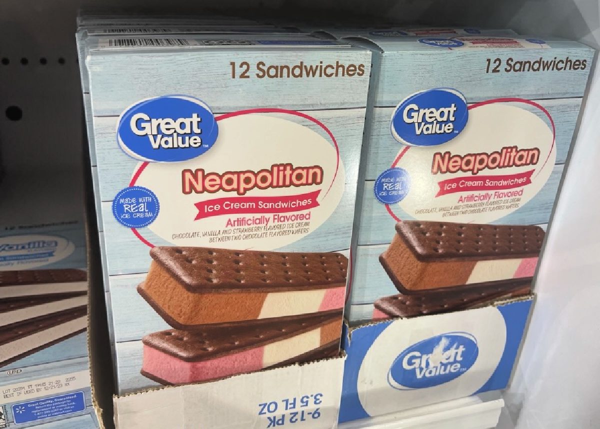A freezer with two packages of Neapolitan Ice Cream sandwiches by Great Value