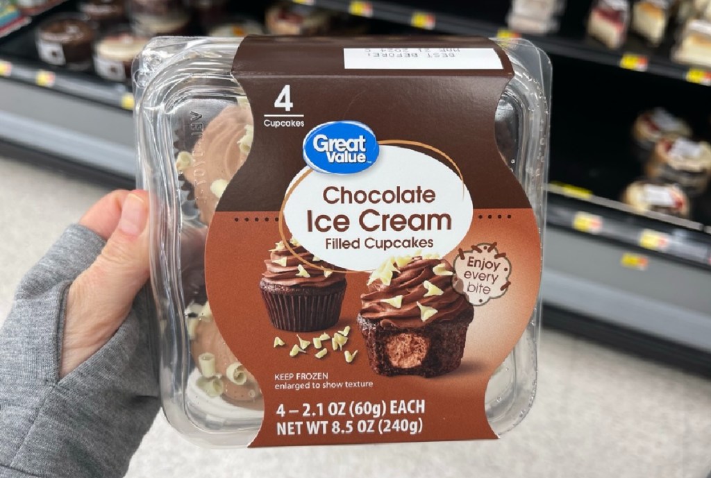 Woman holding a package of Great Value ice cream cupcakes from Walmart