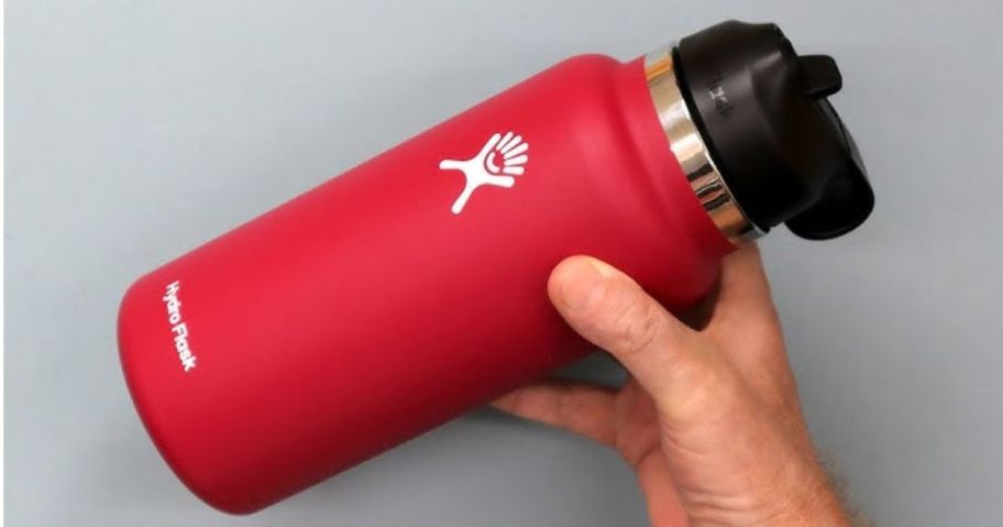 hand holding a red 32 oz Hydro Flask water bottle