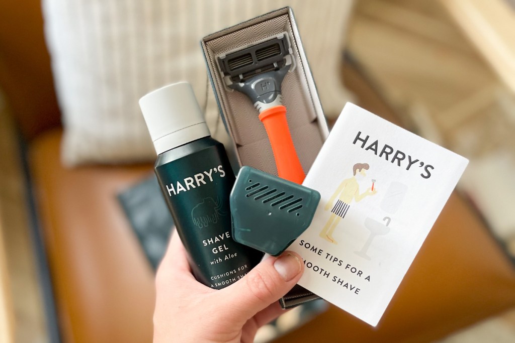 Hand holding Harry's Shaving kit