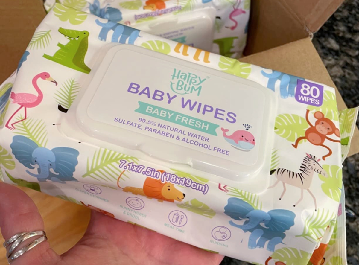 hand holding pack of Happy Bum Sensitive Water Baby Wipes