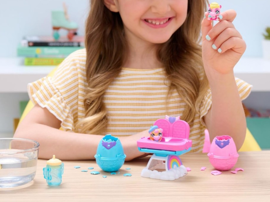 little girl playing with Hatchimals Alive PlaySet