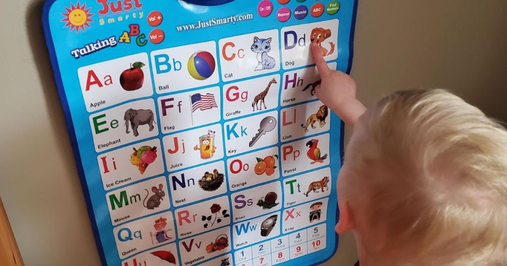 boy playing with a Just Smarty poster