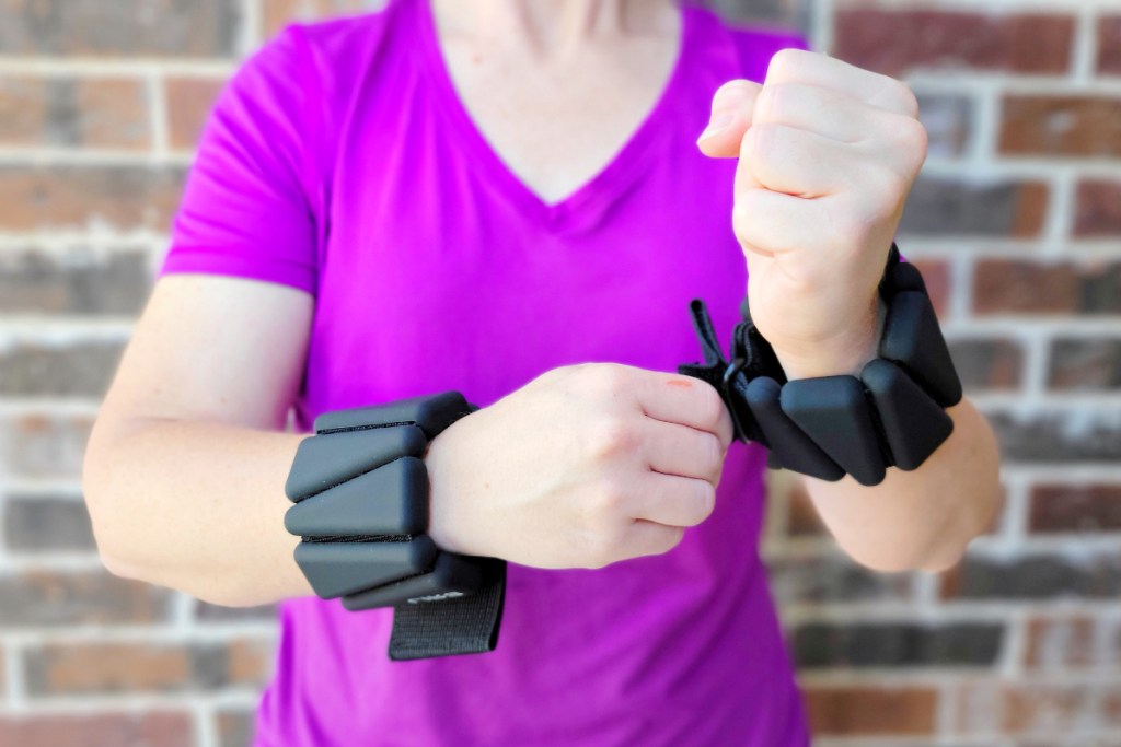 Lady adjusting wrist weights