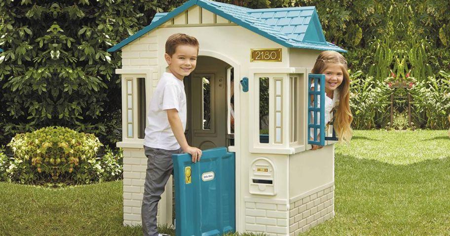 kids playing in a tan and blue Little Tikes Playhouse