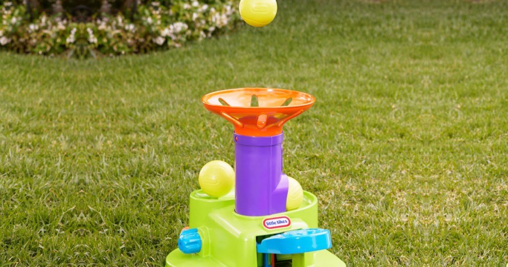 tennis water toy launching ball in yard
