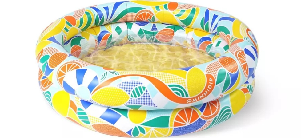 Mini inflatable pool with bright prints of oranges and lemons on it