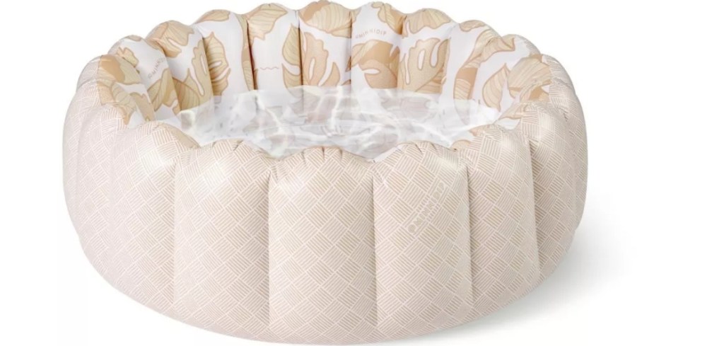 Round tufted inflatable pool with a light tan and white design