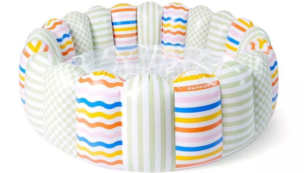 Inflatable pool with a tufted design and different colored stripes on each tuft