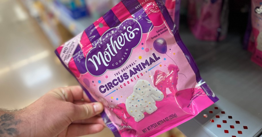 hand holding a bag of frosted animal crackers