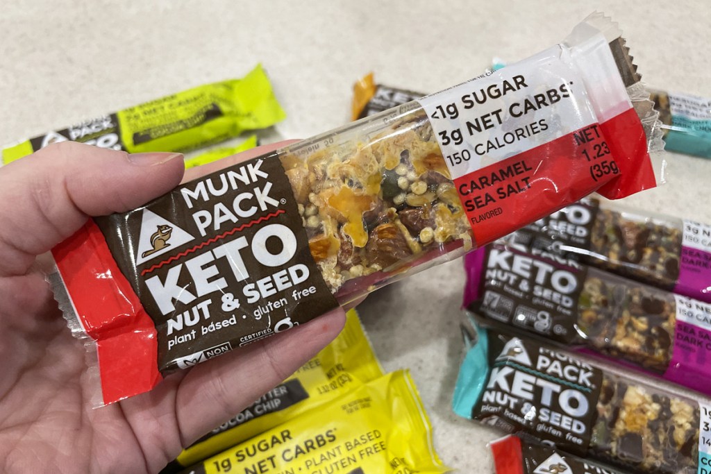 hand holding Munk Pack Keto Seed & Nut Bar