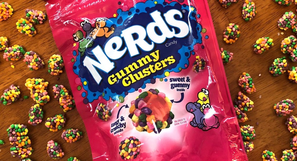 Nerds Gummy Clusters on a table with clusters scattered around