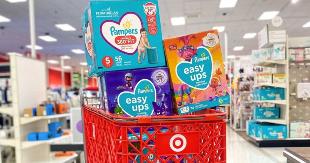 boxes of pampers diapers in target shopping cart