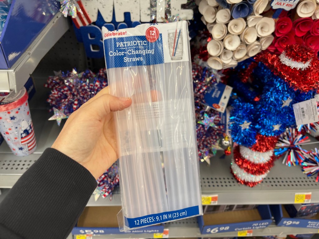 person holding Patriotic Color Changing Straws in store