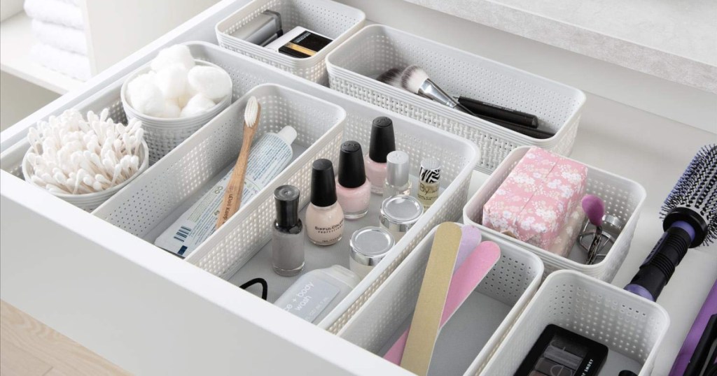 white organizing baskets in desk drawer