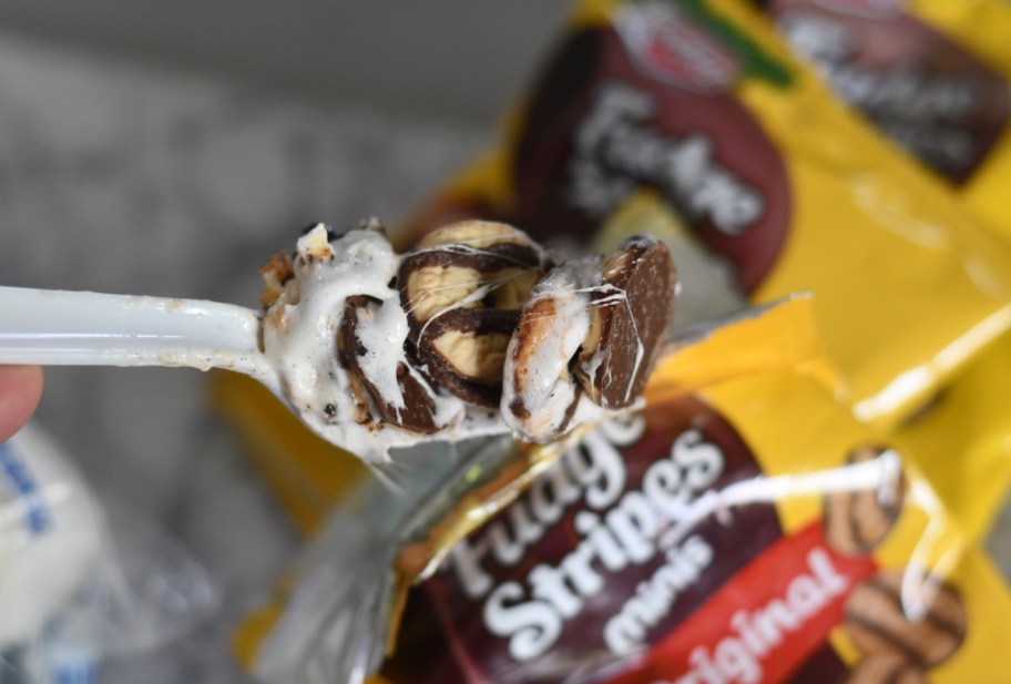 a fork full of walking s'mores in a bag that was made with mini fudge strip cookies
