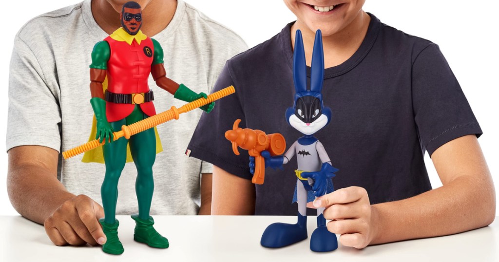 two boys playing with two movie figure toys