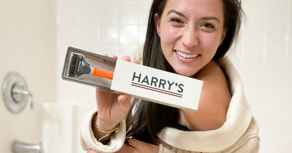 Woman in shower holding Harry Razor