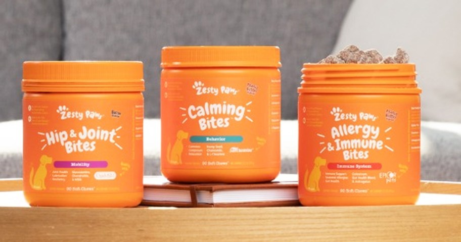 3 orange jars of Zesty Paws Dog Supplements on a table