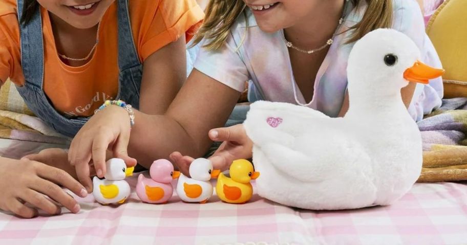 2 kids playing with a Zuru Pets Alive Mama Duck 