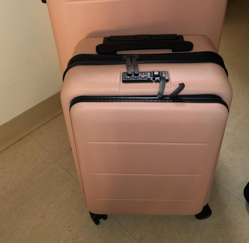 blush carry on luggage with front pocket