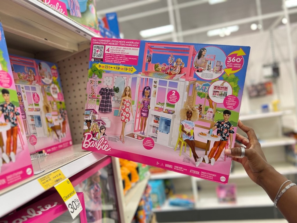 taking a Barbie estate house off the shelf at Target