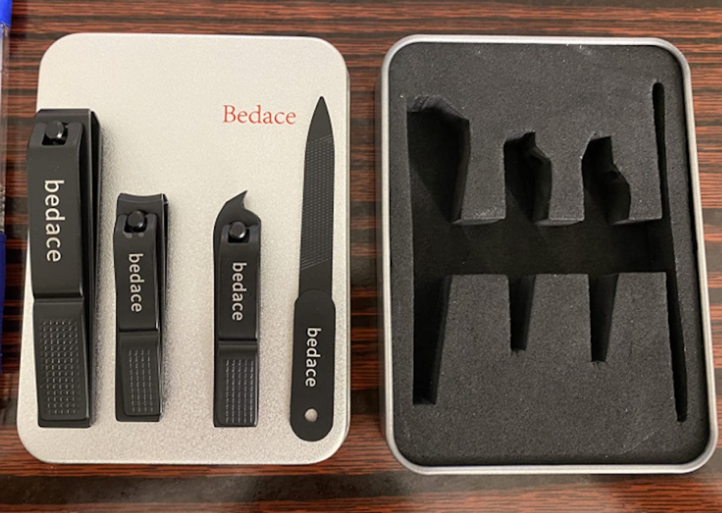 black set of nail clippers on tin travel case