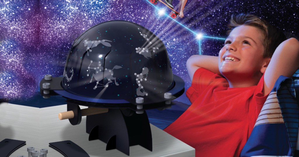 boy looking at planetarium