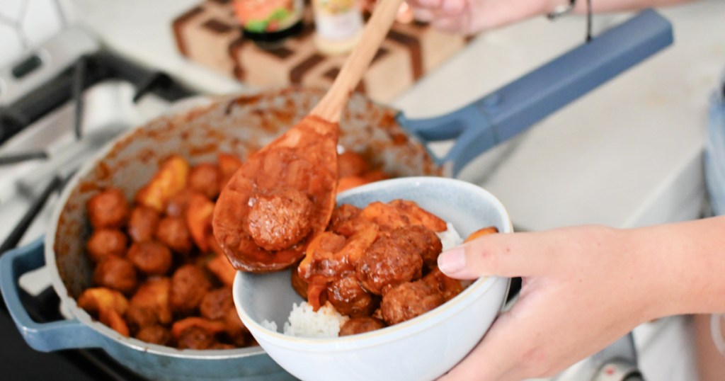 dishing up frozen meatballs meal in a bowl