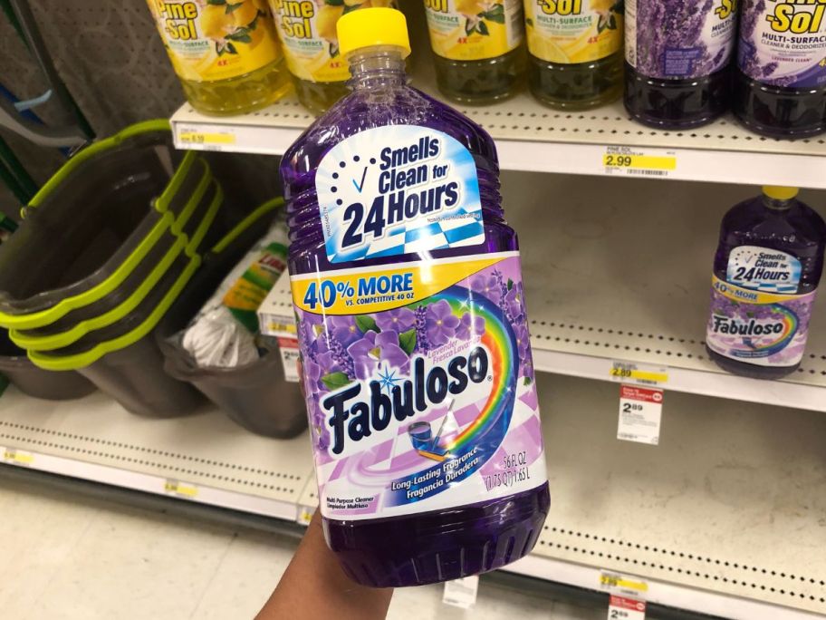 Fabuloso Multi-Purpose Cleaner in Lavender 56oz being held by hand in store