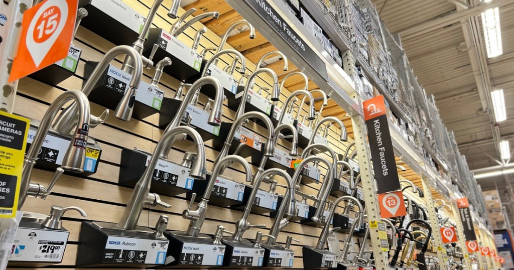 kitchen faucets on display wall at home depot