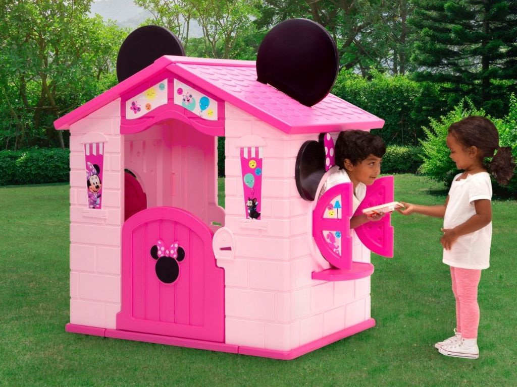 kids playing in Minnie Mouse house