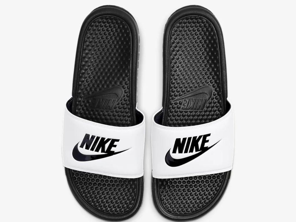 white and black Nike slides