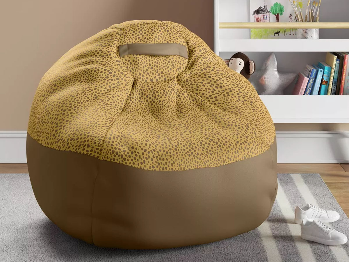 yellow cheetah bean bag chair in bedroom