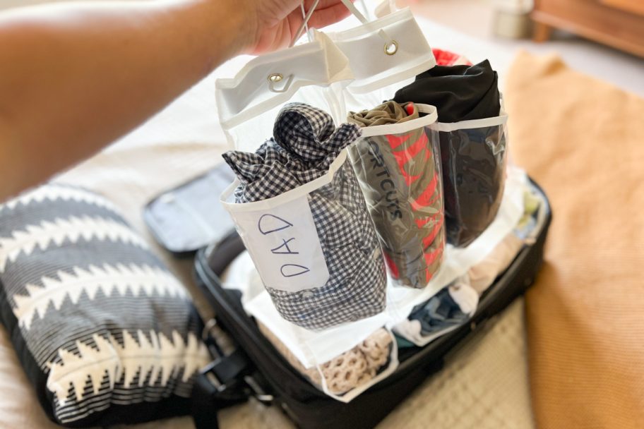 putting shoe organizer into suitcase travel packing hacks
