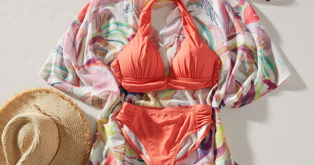 peach swomsuit and colorful coverup