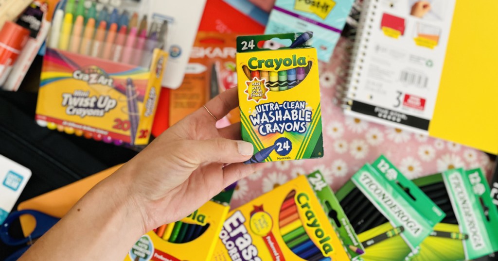 hand holding crayola crayons